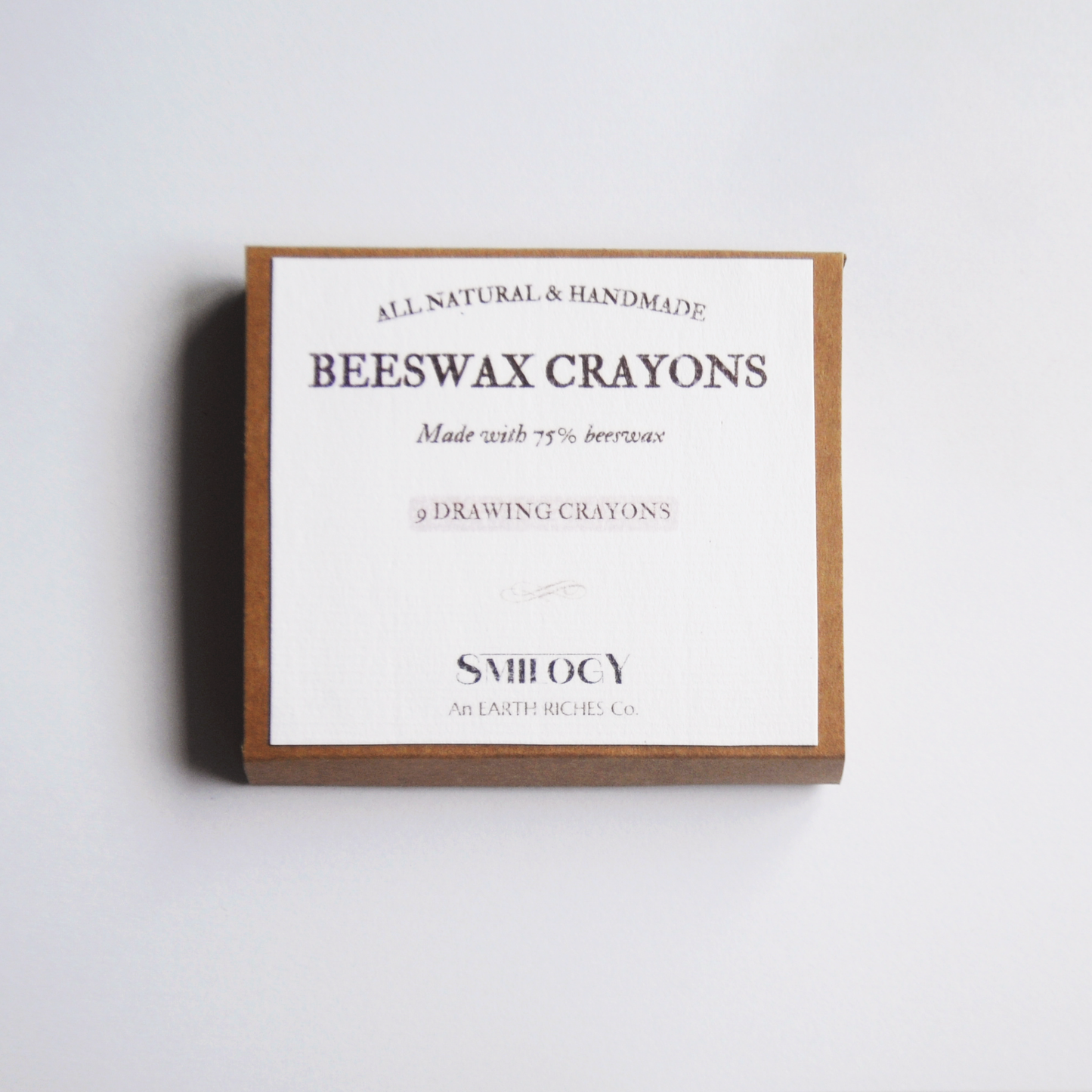 box of beeswax drawing crayons, white label with Smilogy brand on top stuck on a kraft box