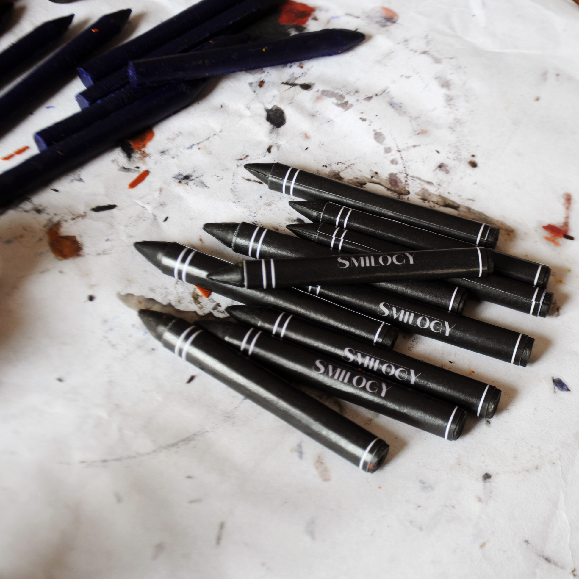 nontoxic and all natural black beeswax crayons from the drawing crayon set wrapped and ready on a white surface